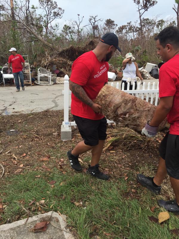 Wells Fargo employees worked hard doing debris removal and cleanup.