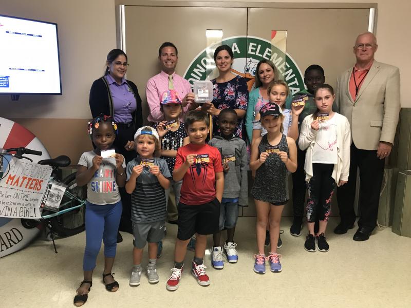 Publix Tools for Back to School gift cards are accepted by Poinciana Elementary staff and students and Superintendent Mark Porter.
